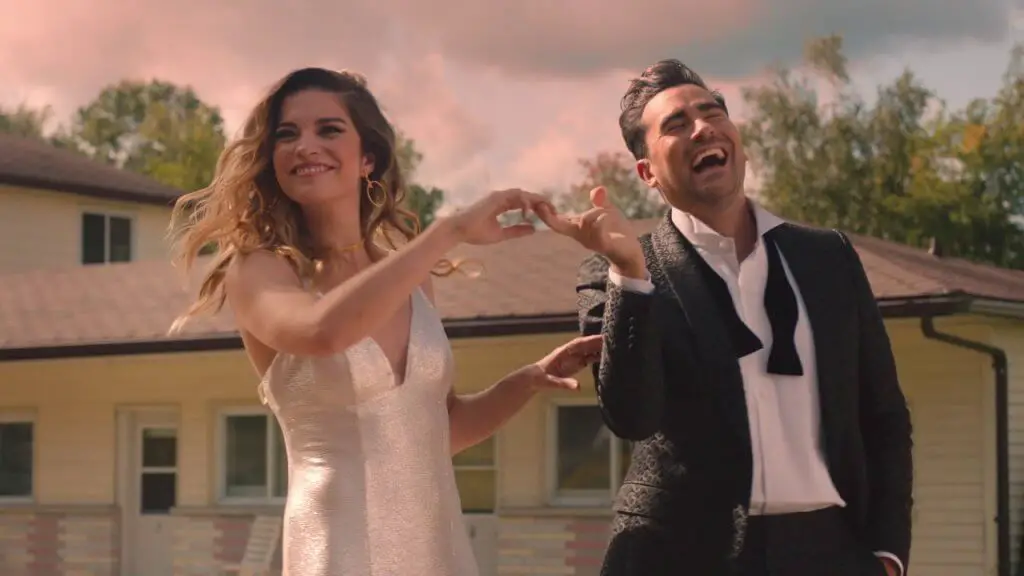 The couple is enjoying while walking on the road, Schitt's Creek Season 6 review