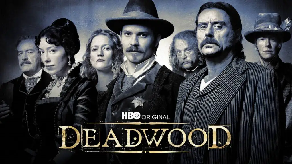 text- deadwood. A group of people standing