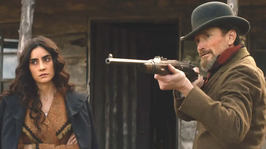 A man holding a gun and a woman standing beside him [shows like Yellowstone]