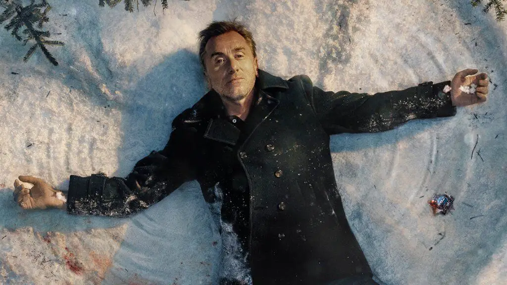 a man lying in the snow