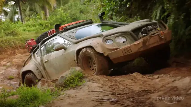 a car drowning in mud