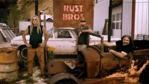 Cars, men standing and posing