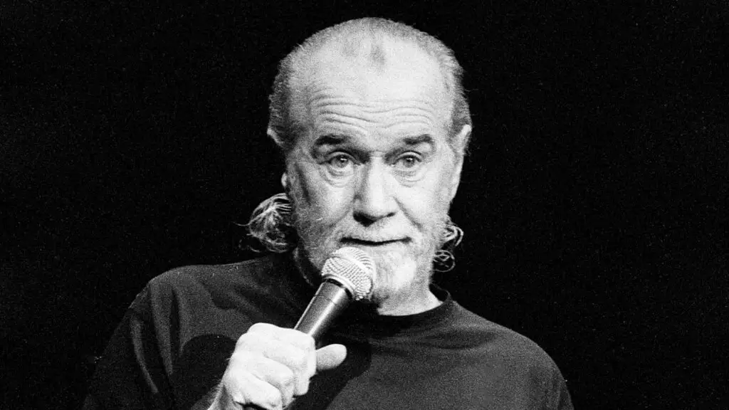 George Carlin is talking to someone