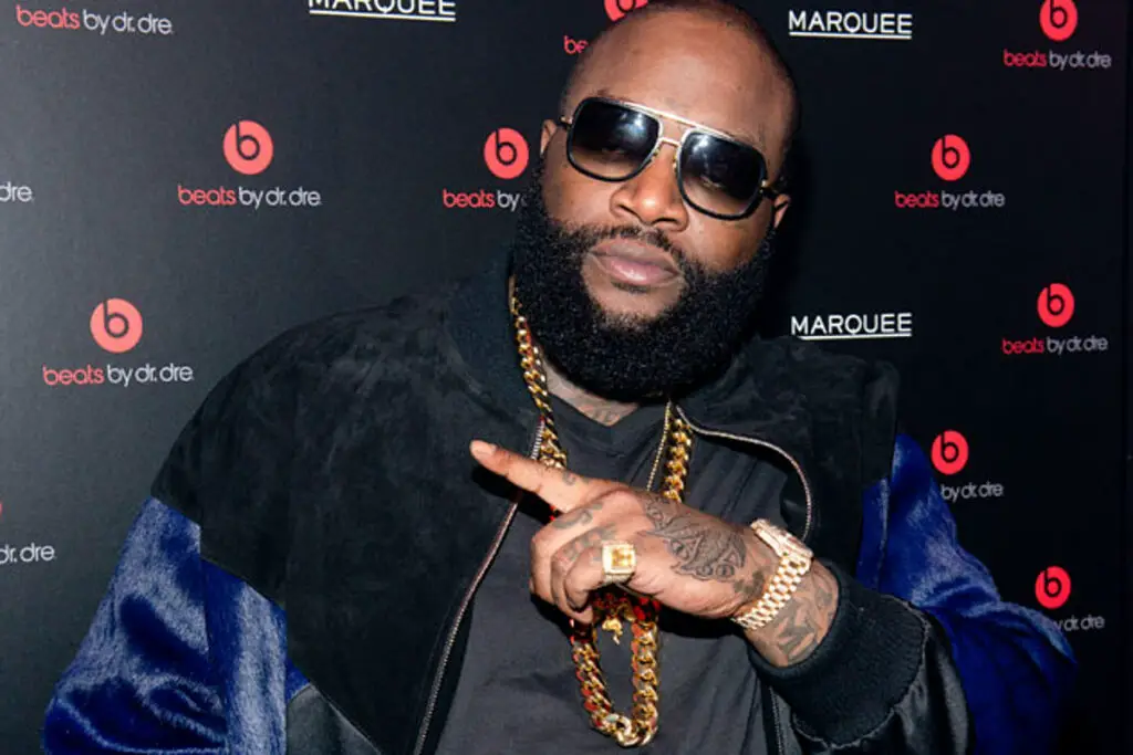 Rick Ross posing with hand