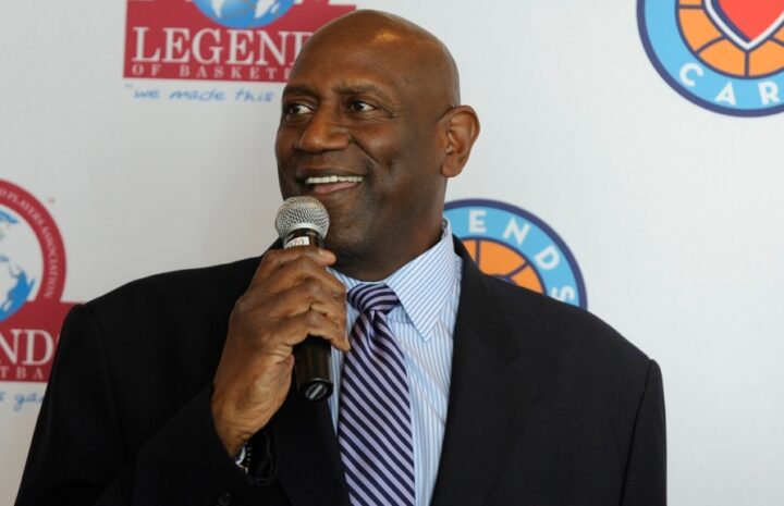 Spencer Haywood holding a mike