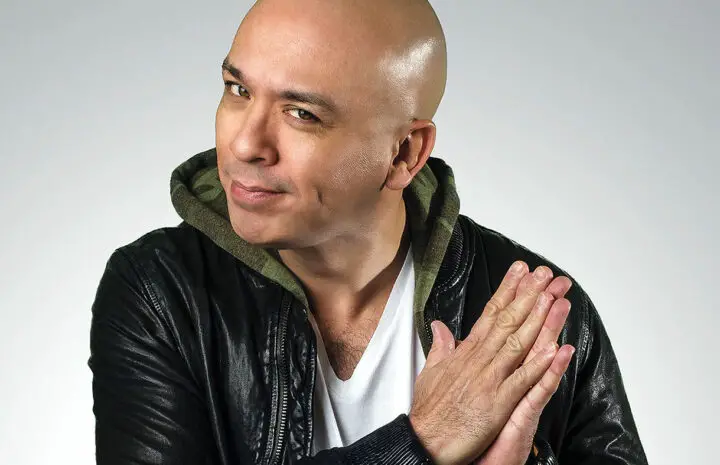 Jo Koy posing with his hands