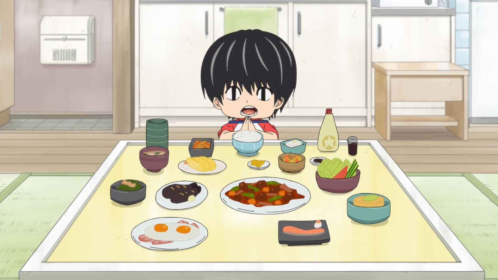 Kotaro with several dishes on his table