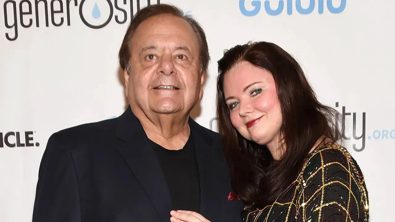 Paul Sorvino and his wife posing for the cameras