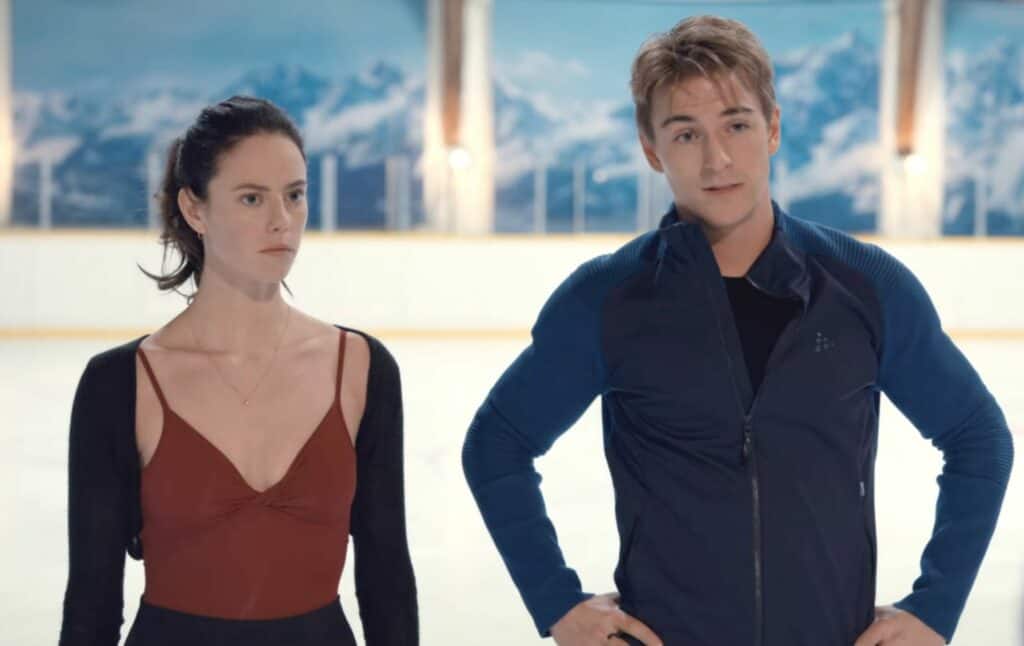 kate and her partner in ice skating are standing together