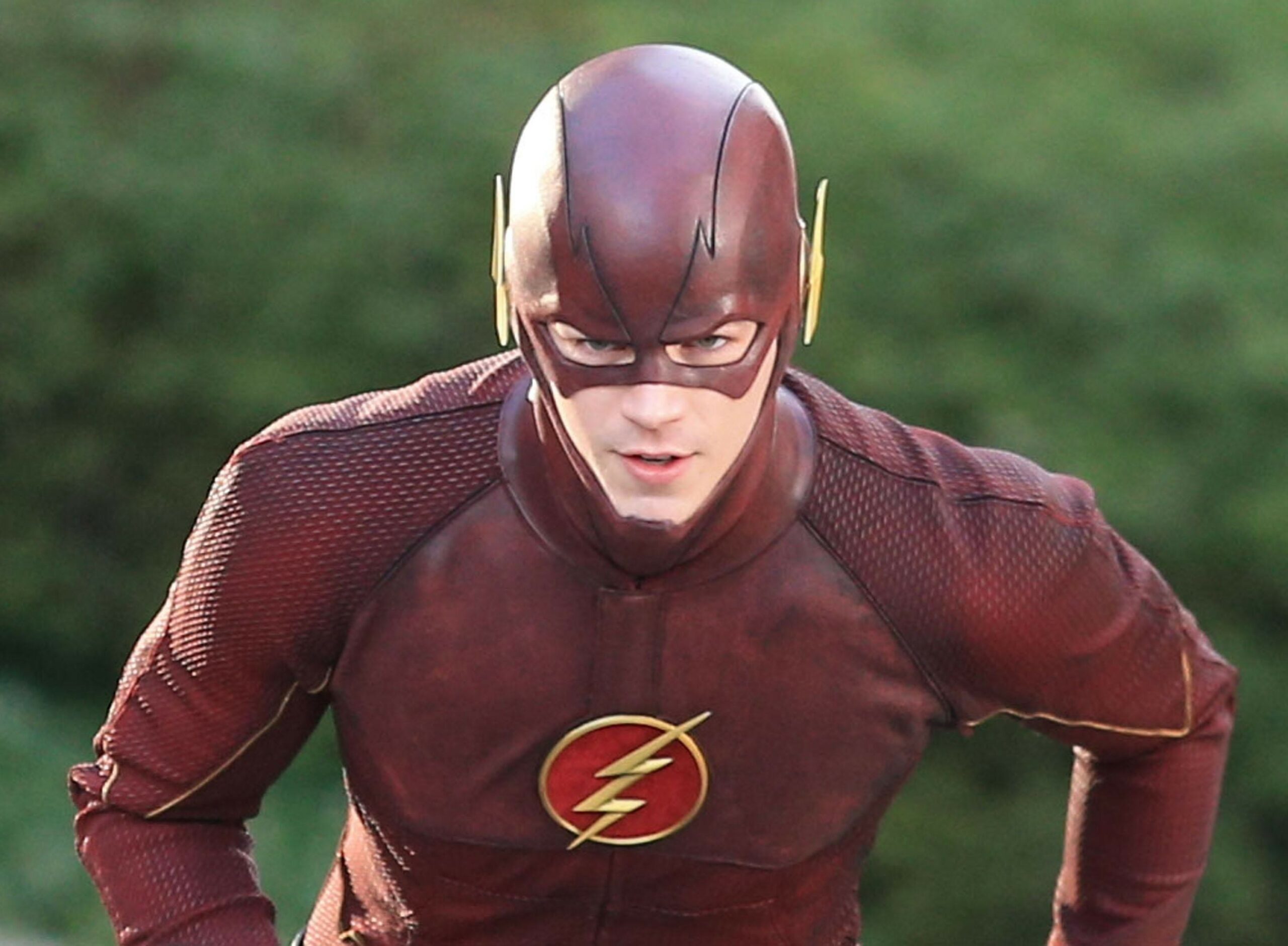 A superhero is looking at somewhere | the flash season 10 is not happening