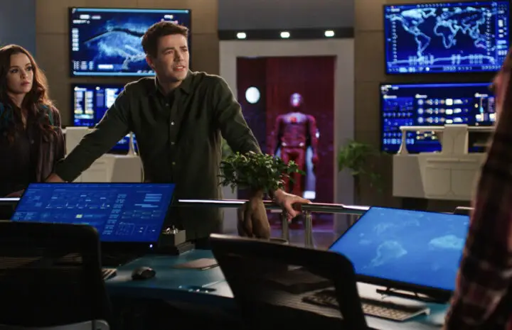 The Flash Season 9 Episode 8 - Two people are looking at something